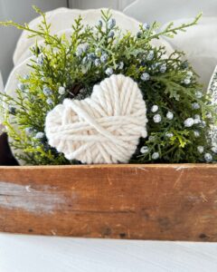yarn wrapped hearts styled in wooden box